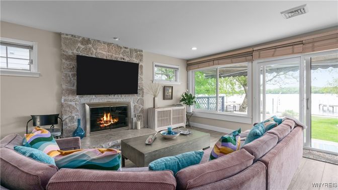 Fireplace, Interior, Living room, Recessed Lighting, Stone Walls, Wood Texture Flooring