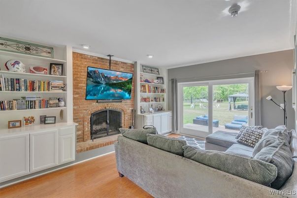 Fireplace, Interior, Living room, Recessed Lighting, Stone Walls, Wood Texture Flooring