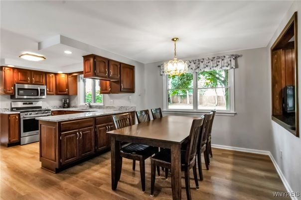 Chandelier, Dining room, Interior, Kitchen, Recessed Lighting, Stainless Steel Appliances, Wood Texture Flooring