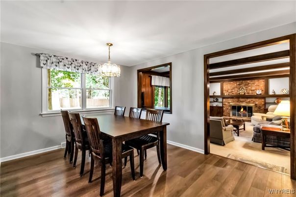 Chandelier, Dining room, Fireplace, Interior, Living room, Stone Walls, Wood Texture Flooring