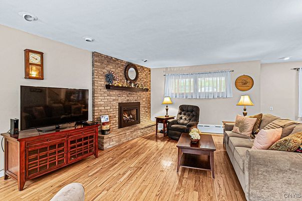 Fireplace, Interior, Living room, Recessed Lighting, Stone Walls, Wood Texture Flooring