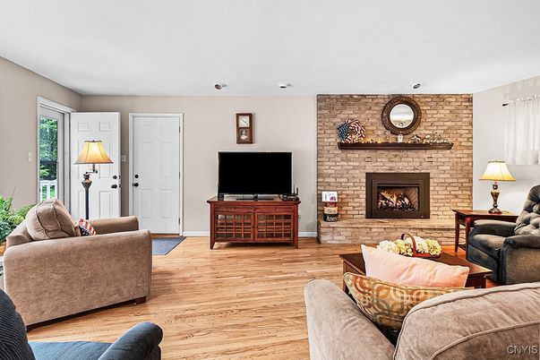 Fireplace, Interior, Living room, Recessed Lighting, Stone Walls, Wood Texture Flooring