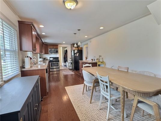 Dining room, Interior, Kitchen, Pendant Lights, Recessed Lighting, Stainless Steel Appliances, Wood Texture Flooring