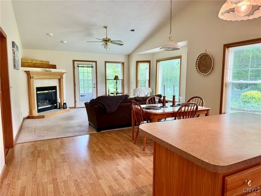Dining room, Fireplace, Interior, Living room, Pendant Lights, Recessed Lighting, Wood Texture Flooring