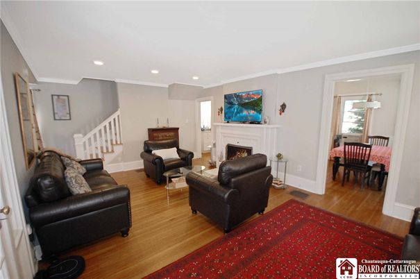 Dining room, Fireplace, Interior, Living room, Pendant Lights, Recessed Lighting, Wood Texture Flooring