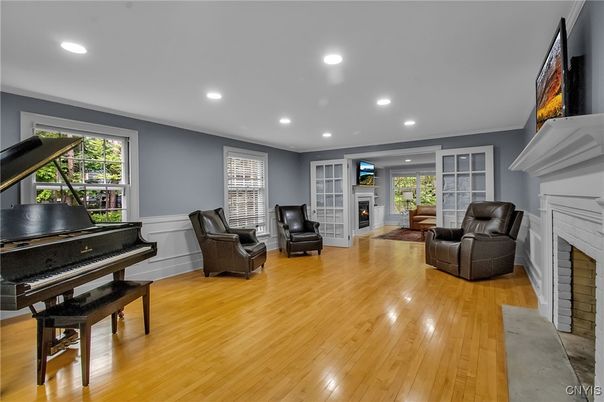 Fireplace, Interior, Living room, Piano, Recessed Lighting, Wood Texture Flooring