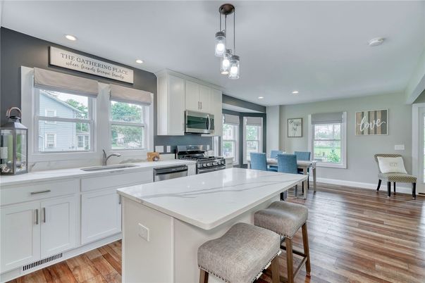Dining room, Interior, Kitchen, Pendant Lights, Recessed Lighting, Stainless Steel Appliances, Wood Texture Flooring