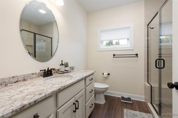 Bathroom, Dual Sink Vanities, Glass Shower, Interior, Recessed Lighting, Wood Texture Flooring