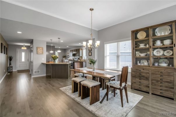 Chandelier, Dining room, Interior, Kitchen, Pendant Lights, Recessed Lighting, Stainless Steel Appliances, Wood Texture Flooring