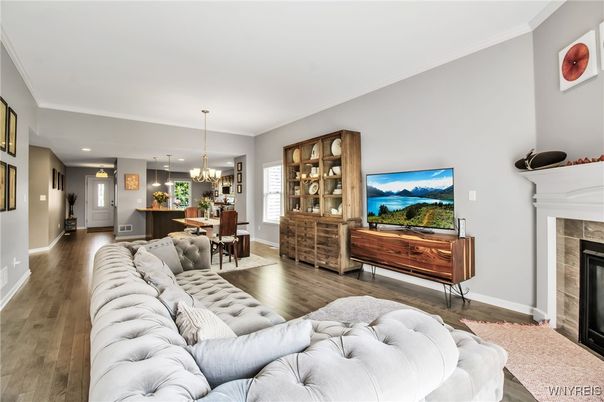 Chandelier, Dining room, Fireplace, Interior, Living room, Pendant Lights, Recessed Lighting, Wood Texture Flooring