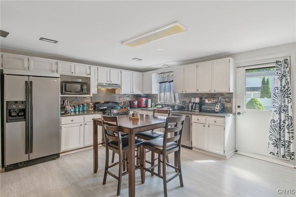 Dining room, Interior, Kitchen, Recessed Lighting, Stainless Steel Appliances, Wood Texture Flooring