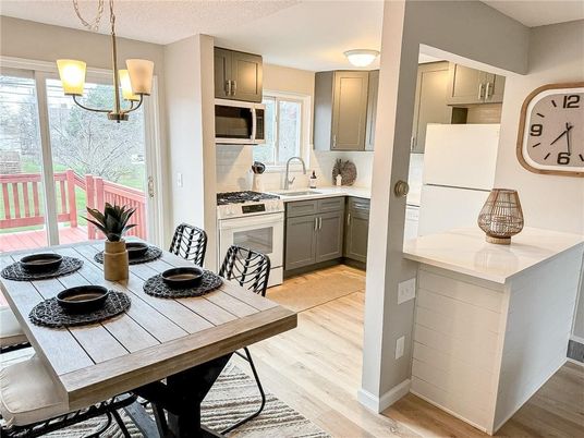 Dining room, Interior, Kitchen, Pendant Lights, Stainless Steel Appliances, Wood Texture Flooring