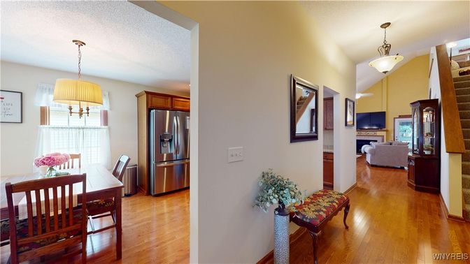 Dining room, Fireplace, Interior, Kitchen, Living room, Pendant Lights, Stainless Steel Appliances, Wood Texture Flooring