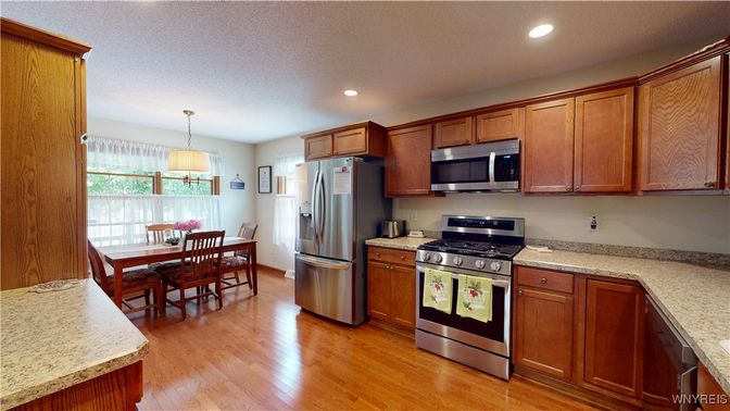 Dining room, Interior, Kitchen, Pendant Lights, Recessed Lighting, Stainless Steel Appliances, Wood Texture Flooring