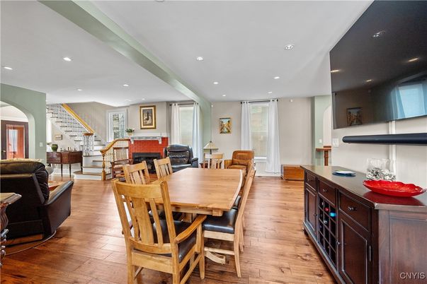 Dining room, Fireplace, Interior, Living room, Recessed Lighting, Wood Texture Flooring