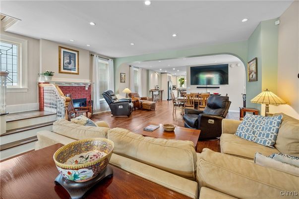 Dining room, Fireplace, Interior, Living room, Recessed Lighting, Wood Texture Flooring