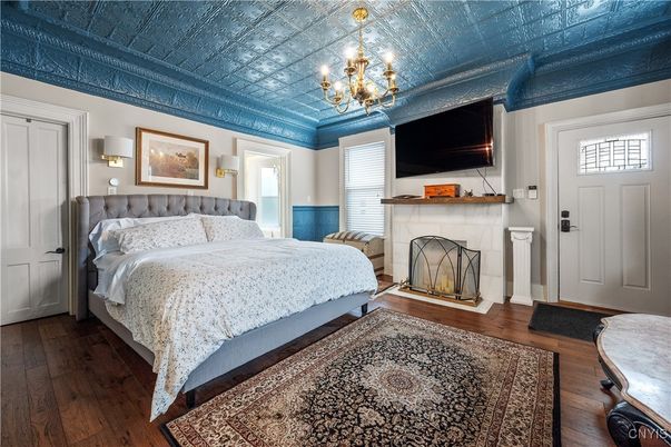 Bedroom, Chandelier, Fireplace, Interior, Wood Texture Flooring
