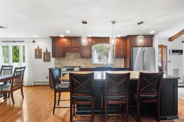 Dining room, Interior, Kitchen, Pendant Lights, Recessed Lighting, Stainless Steel Appliances, Wooden Beams, Wood Texture Flooring