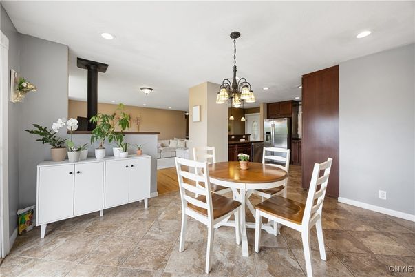 Chandelier, Dining room, Fireplace, Interior, Kitchen, Pendant Lights, Recessed Lighting, Stainless Steel Appliances