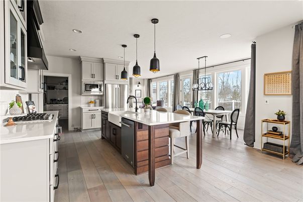 Dining room, Interior, Kitchen, Pendant Lights, Recessed Lighting, Stainless Steel Appliances, Wood Texture Flooring