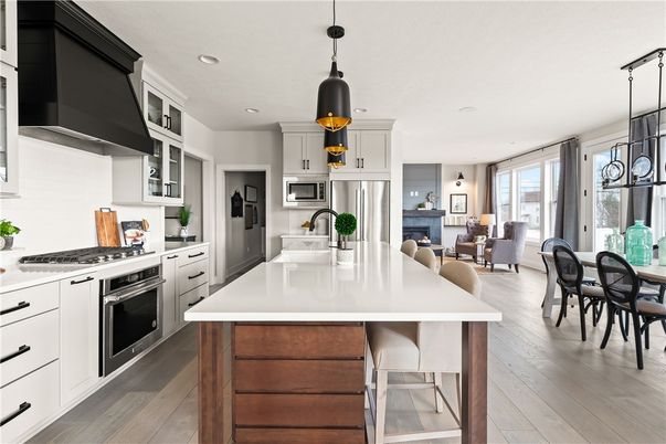 Dining room, Interior, Kitchen, Pendant Lights, Recessed Lighting, Stainless Steel Appliances, Wood Texture Flooring