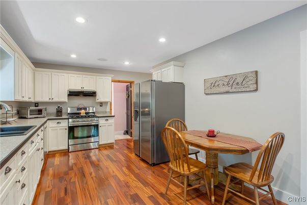 Dining room, Interior, Kitchen, Recessed Lighting, Stainless Steel Appliances, Wood Texture Flooring