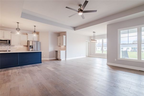 Empty room, Interior, Kitchen, Pendant Lights, Stainless Steel Appliances, Wood Texture Flooring