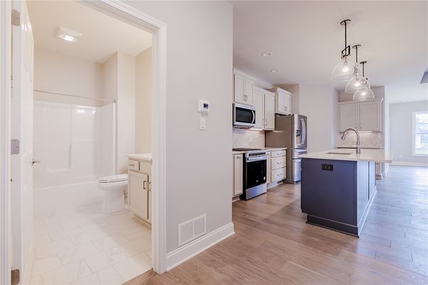Interior, Kitchen, Marble, Pendant Lights, Recessed Lighting, Stainless Steel Appliances, Wood Texture Flooring