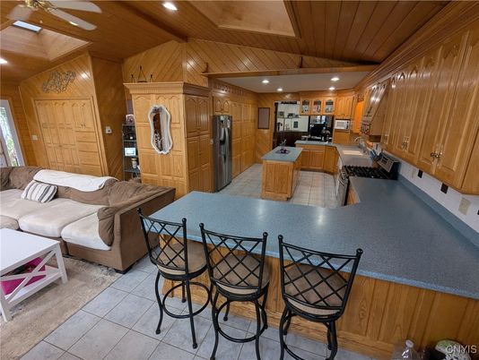 Interior, Kitchen, Living room, Recessed Lighting, Stainless Steel Appliances, Wooden Ceilings, Wooden Walls