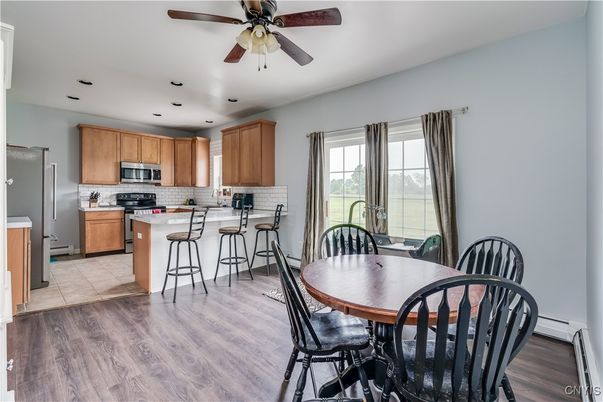 Dining room, Interior, Kitchen, Recessed Lighting, Stainless Steel Appliances, Wood Texture Flooring