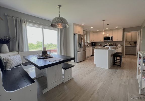 Dining room, Interior, Kitchen, Pendant Lights, Recessed Lighting, Stainless Steel Appliances, Wood Texture Flooring
