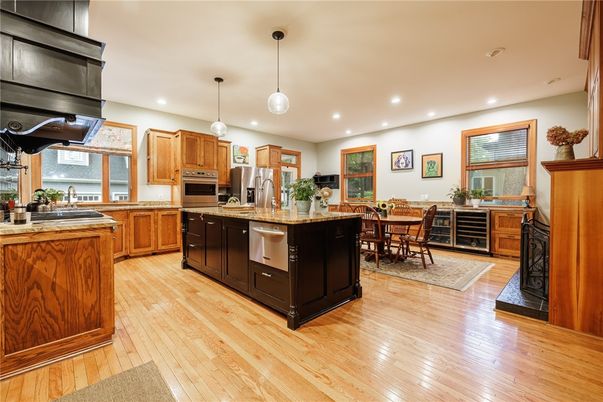 Dining room, Interior, Kitchen, Pendant Lights, Recessed Lighting, Stainless Steel Appliances, Wood Texture Flooring