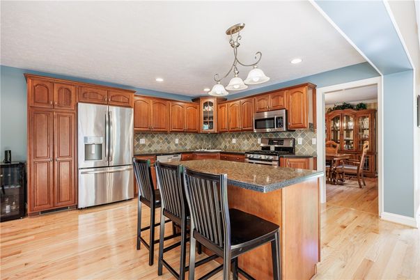 Chandelier, Dining room, Interior, Kitchen, Recessed Lighting, Stainless Steel Appliances, Wood Texture Flooring