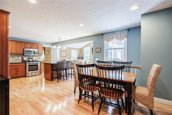 Dining room, Interior, Kitchen, Pendant Lights, Recessed Lighting, Stainless Steel Appliances, Wood Texture Flooring