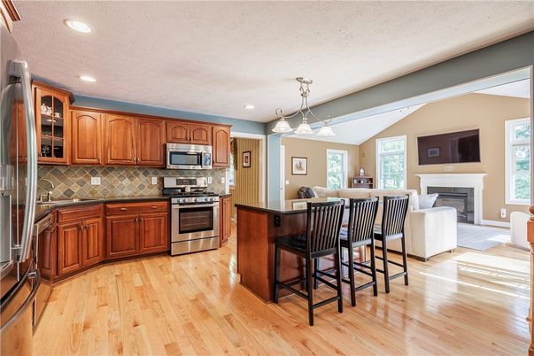 Fireplace, Interior, Kitchen, Pendant Lights, Recessed Lighting, Stainless Steel Appliances, Wood Texture Flooring