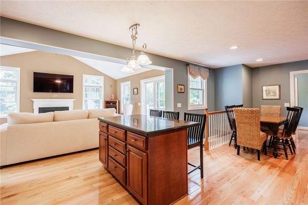 Dining room, Fireplace, Interior, Living room, Pendant Lights, Recessed Lighting, Wood Texture Flooring