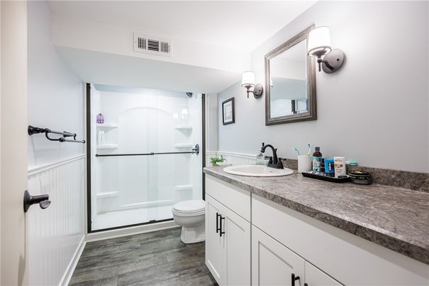 Bathroom, Dual Sink Vanities, Glass Shower, Interior, Wood Texture Flooring