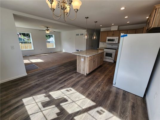 Chandelier, Interior, Kitchen, Pendant Lights, Recessed Lighting, Stainless Steel Appliances, Wood Texture Flooring