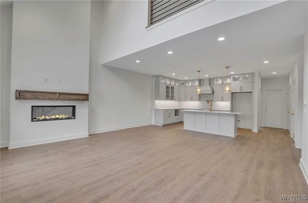 Empty room, Fireplace, Interior, Kitchen, Pendant Lights, Recessed Lighting, Wood Texture Flooring