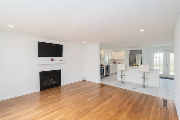 Empty room, Fireplace, Interior, Kitchen, Marble, Recessed Lighting, Wood Texture Flooring
