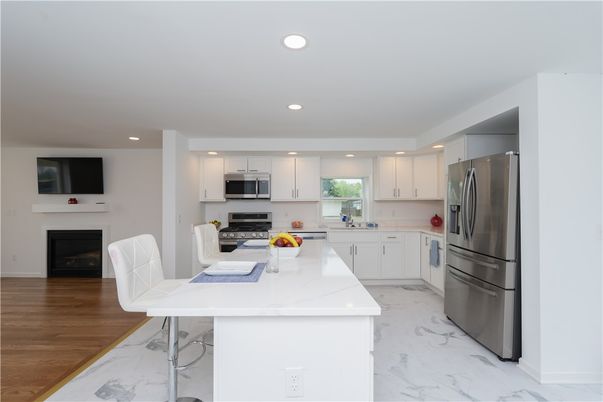 Dining room, Interior, Kitchen, Marble, Recessed Lighting, Stainless Steel Appliances, Wood Texture Flooring