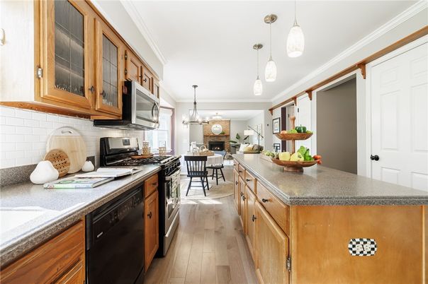Chandelier, Dining room, Fireplace, Interior, Kitchen, Pendant Lights, Wood Texture Flooring