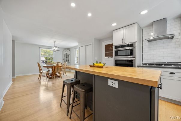 Dining room, Interior, Kitchen, Recessed Lighting, Stainless Steel Appliances, Wood Texture Flooring