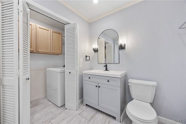 Bathroom, Interior, Recessed Lighting, Utility Closets, Washer, Wood Texture Flooring
