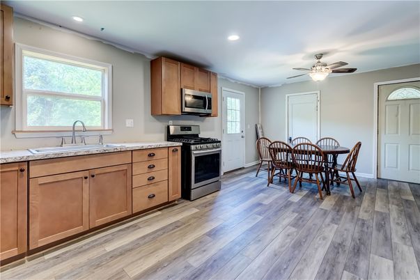 Dining room, Interior, Kitchen, Recessed Lighting, Stainless Steel Appliances, Wood Texture Flooring