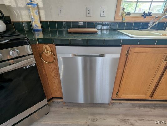 Interior, Kitchen, Stainless Steel Appliances, Tile Countertops, Wood Texture Flooring