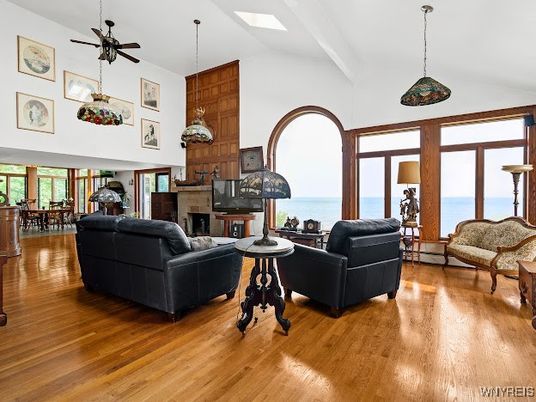 Dining room, Fireplace, Interior, Living room, Pendant Lights, Water, Wood Texture Flooring