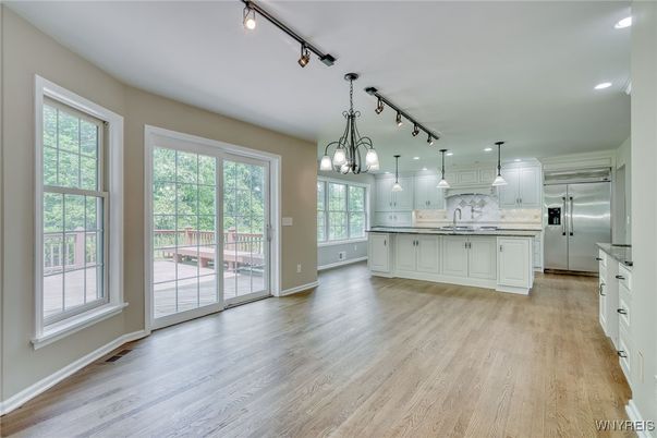 Interior, Kitchen, Marble Walls, Pendant Lights, Recessed Lighting, Stainless Steel Appliances, Wood Texture Flooring