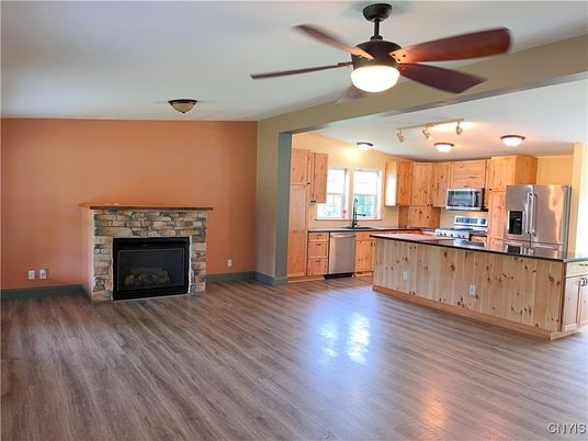 Fireplace, Interior, Kitchen, Stainless Steel Appliances, Wood Texture Flooring