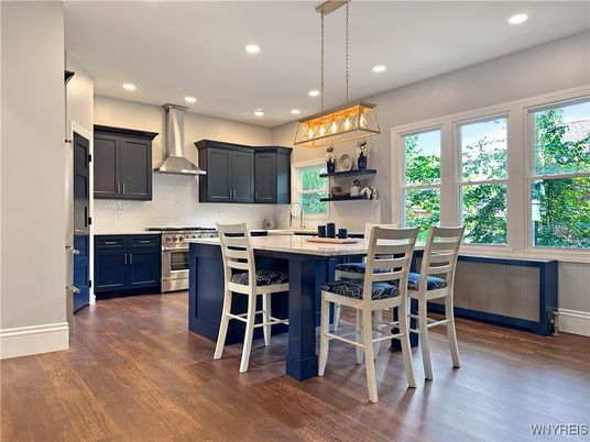 Dining room, Interior, Kitchen, Pendant Lights, Recessed Lighting, Stainless Steel Appliances, Wood Texture Flooring